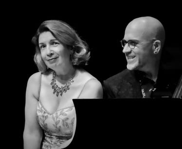 Guy Few and Leslie Fagan seated at piano. Copyright © 2024 Mark Rash